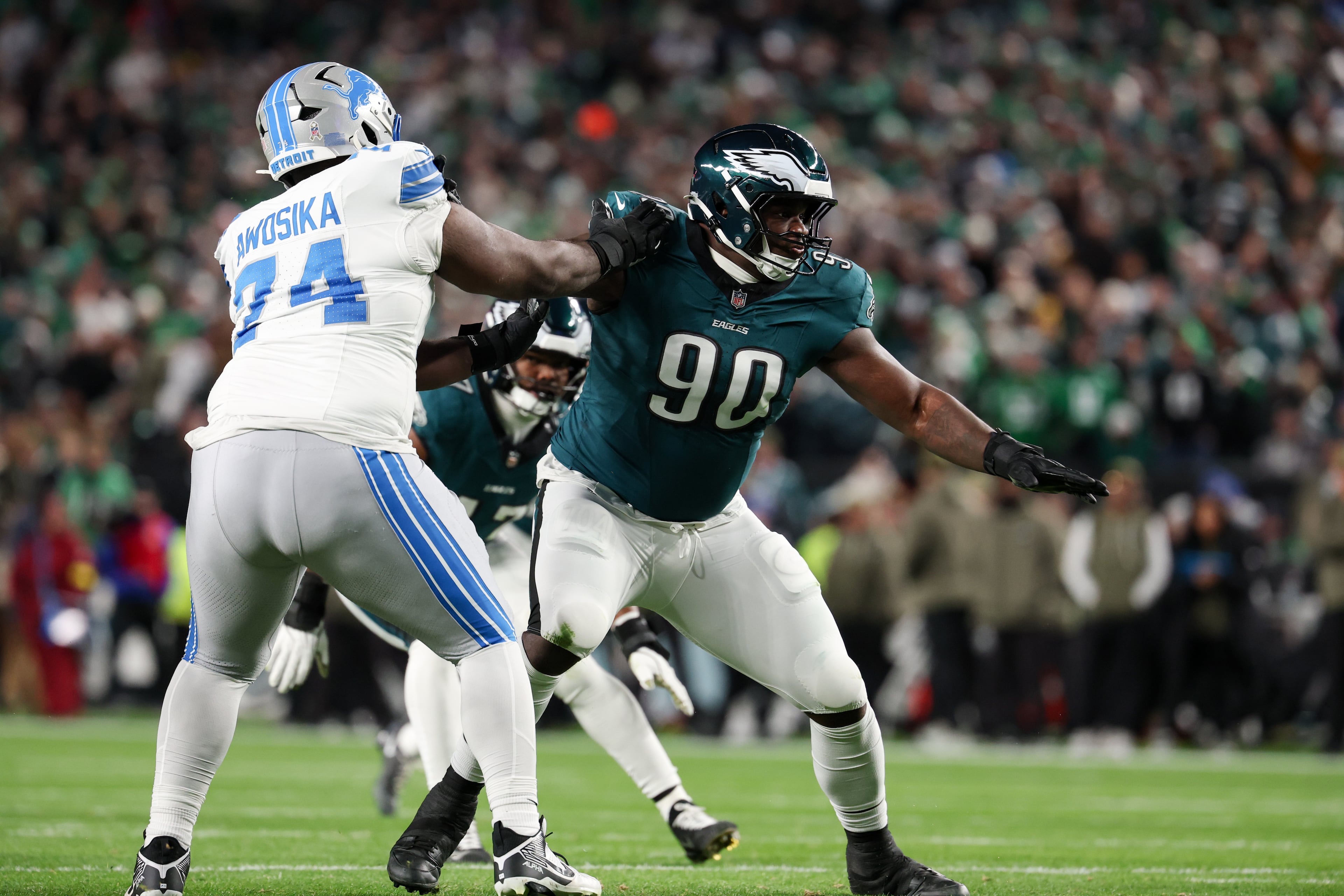 Eagles defensive tackle Jordan Davis (center) takes on Lions guard Kayode Awosika during the first half Sunday, Nov. 16, 2025, in Philadelphia. Davis had a tackle and three pass deflections. (Terrance Williams/AP)