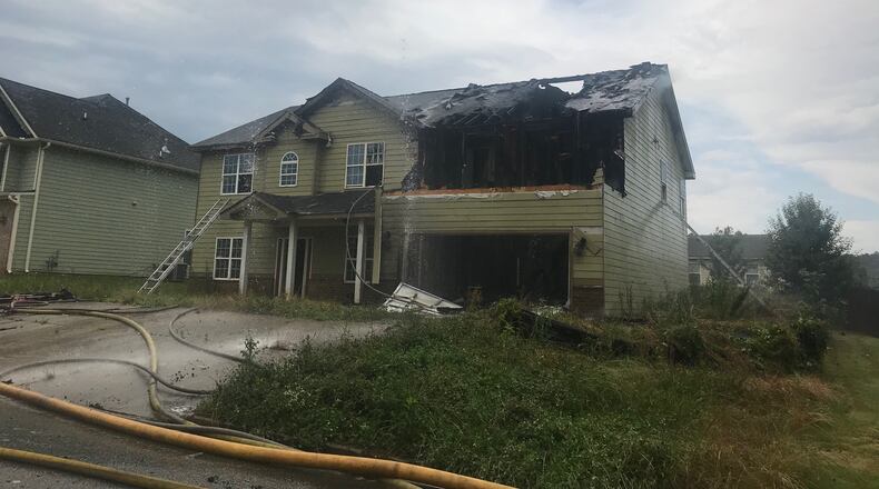 A vacant home in Snellville caught fire after it was struck by lightning Friday afternoon.