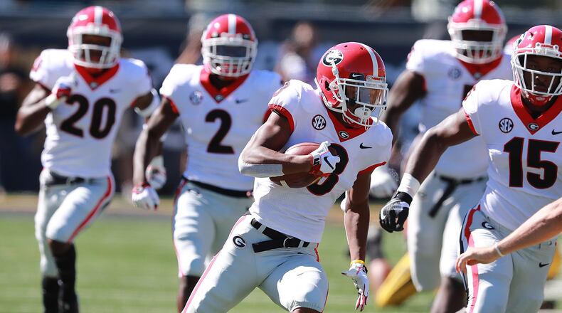 Georgia defensive back Tyson Campbell strips the ball from Mizzou tight end Albert Okwuegbunam and returns it for a touchdown for a 7-0 lead during the first quarter in a NCAA college football game on Saturday, Sept 22, 2018, in Columbia. Curtis Compton/ccompton@ajc.com
