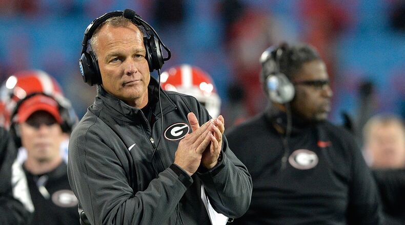 Georgia coach Mark Richt looks quite pleased that his Bulldogs have been picked to win the SEC East. (Photo by Grant Halverson/Getty Images)