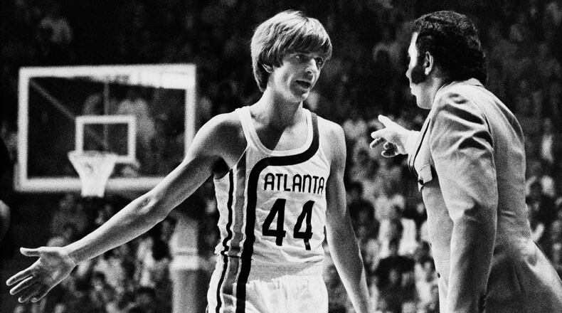 Before making his debut into professional basketball, “Pistol” Pete Maravich receives last minute instructions from Coach Richie Guerin, in Atlanta, Oct. 20, 1970. (AP Photo/Toby Massey)