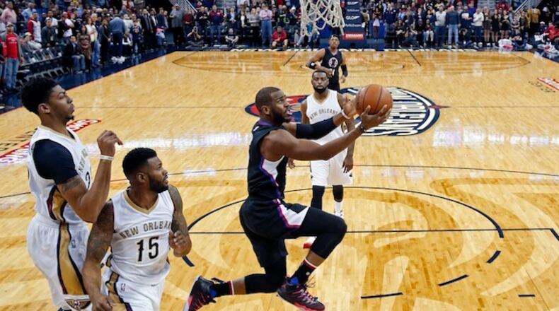 Los Angeles Clippers guard Chris Paul goes to the basket in the first half of an NBA basketball game against the New Orleans Pelicans in New Orleans, Thursday, Dec. 31, 2015. (AP Photo/Gerald Herbert)