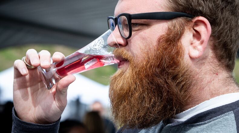 Josh Anderson samples a Savannah Transfusion drink during the Beer, Bourbon, & BBQ Festival at Atlantic Station on Saturday, March 2, 2019. STEVE SCHAEFER / SPECIAL TO THE AJC
