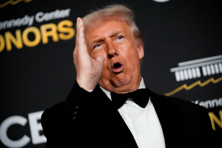 President Donald Trump speaks on the red carpet before the 48th Kennedy Center Honors, Sunday, Dec. 7, 2025, at the John F. Kennedy Center for the Performing Arts in Washington. (AP Photo/Julia Demaree Nikhinson)