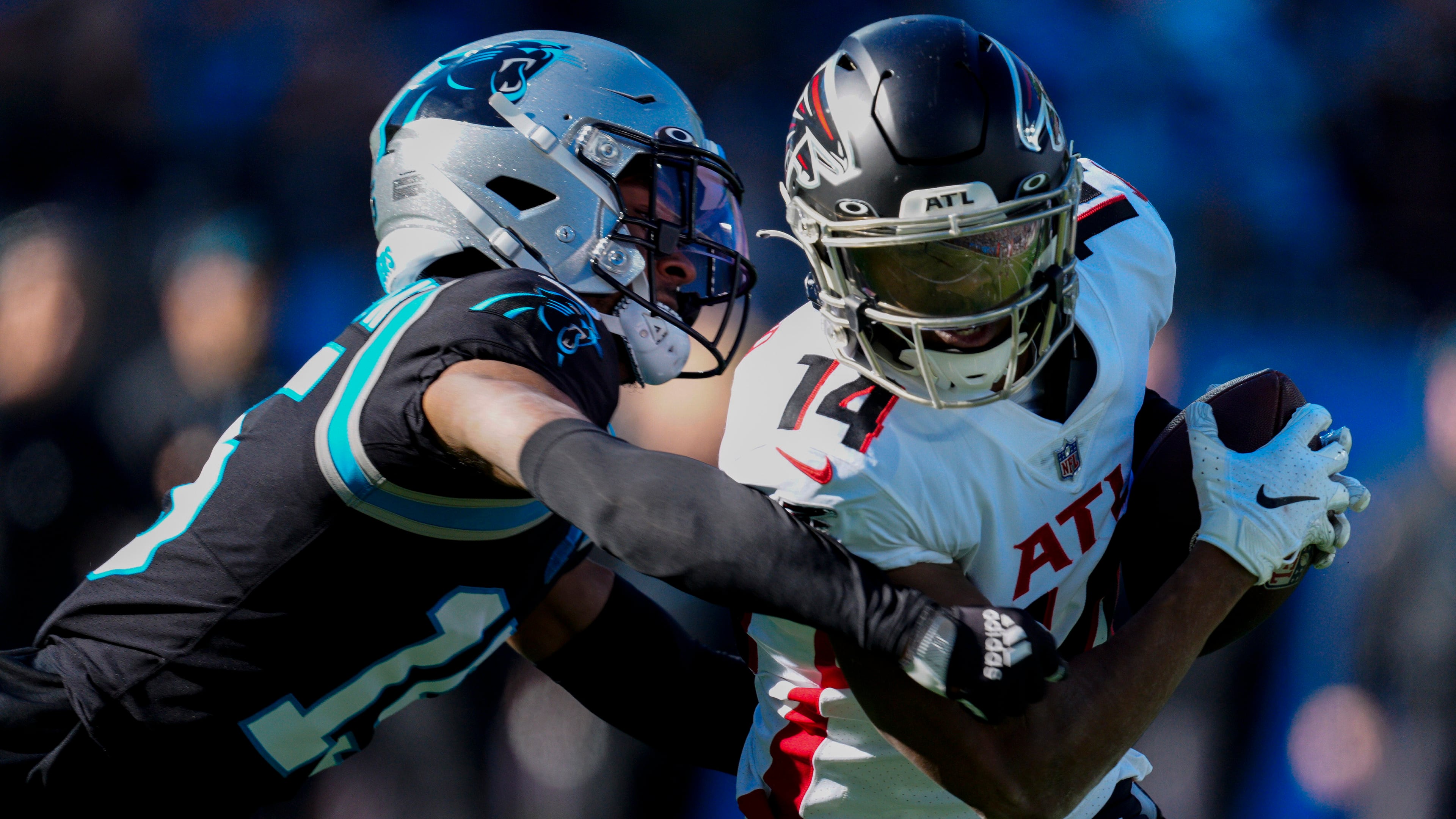 Panthers cornerback C.J. Henderson (right) tackles Falcons wide receiver Russell Gage in 2021. In 49 career games over four seasons, Henderson has 162 tackles, 16 passes defended, three interceptions, two forced fumbles and one sack. (Jacob Kupferman/AP 2021)