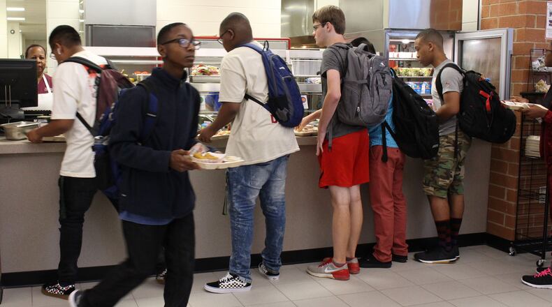Students get lunch at Paul Duke STEM High School in Gwinnett County during a lunch period in 2018. During the pandemic, Gwinnett provided meals for free. Next school year, the district will reinstate charging for meals. (Jenna Eason / AJC file photo)