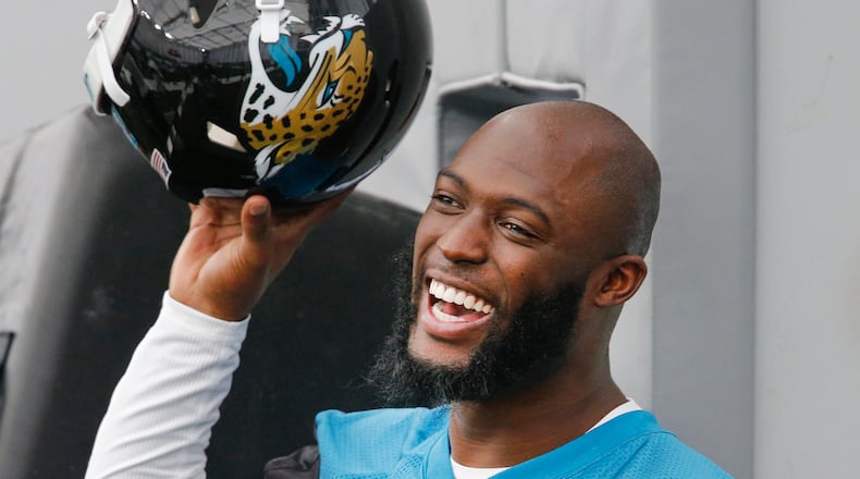 Jacksonville Jaguars running back Leonard Fournette (27) has a laugh on the sidelines during organized team activities at TIAA Bank Field.