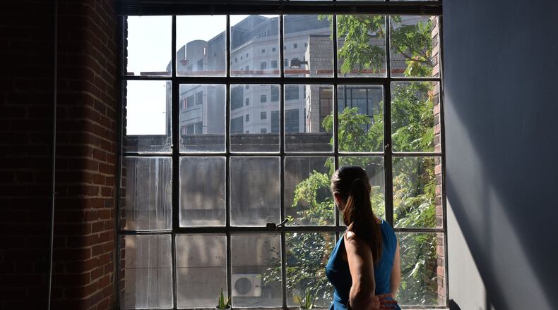 Moki Macias looks to the Atlanta City Detention Center from the offices of the Atlanta/Fulton County Pre-Arrest Diversion Initiative office in downtown. HYOSUB SHIN / HSHIN@AJC.COM
