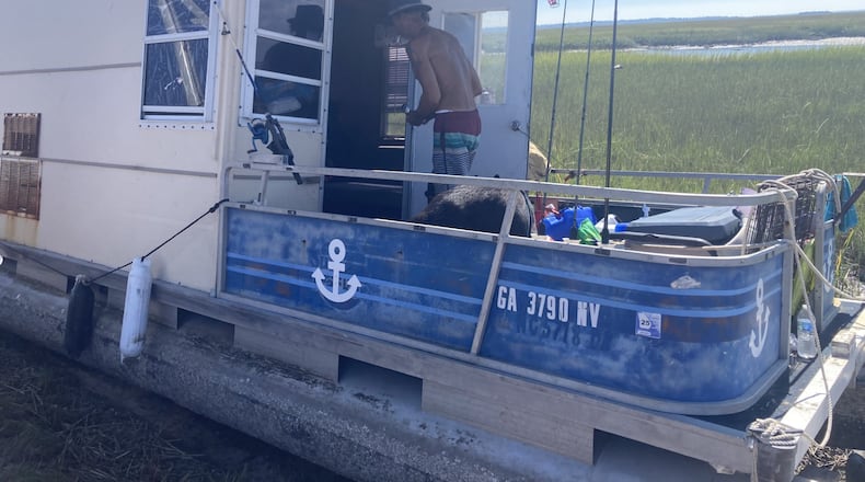 A boater who identifies himself only by the name Huck was washed ashore near Tybee Island during Hurricane Helene. (Adam Van Brimmer/AJC)