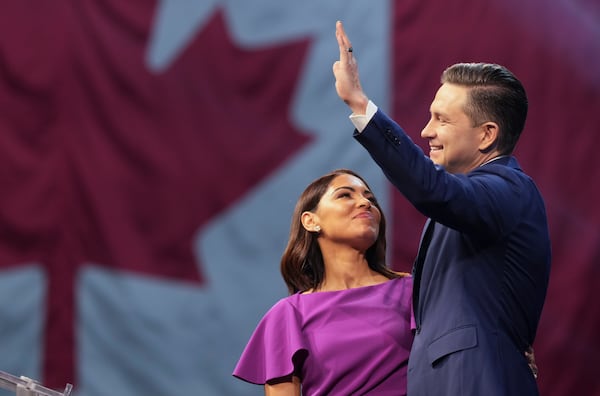 Conservative Leader Pierre Poilievre and his wife Anaida at his campaign headquarters on election night, in Ottawa, Tuesday, April 29, 2025. (Christinne Muschi/The Canadian Press via AP)