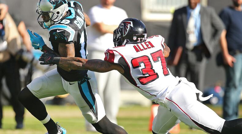 Panthers wide receiver Ted Ginn, Jr., catches his second touchdown pass of the day as Ricardo Allen can't keep up. Curtis Compton/ccompton@ajc.com