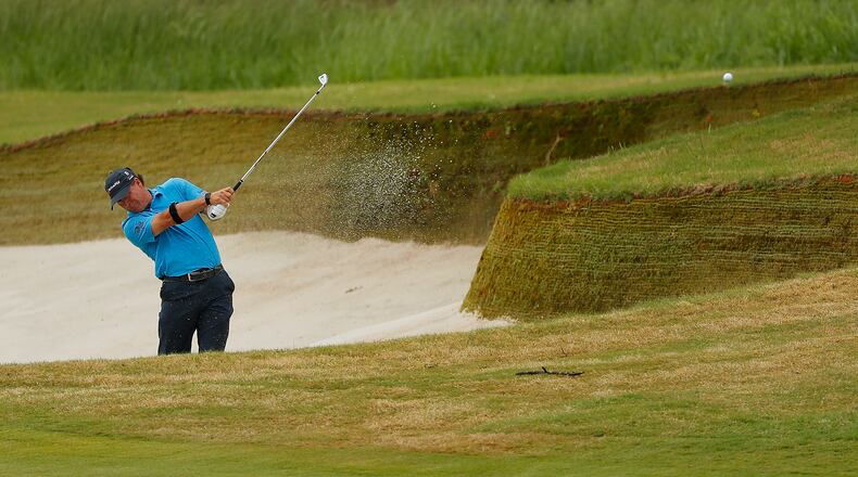 Scott McCarron plays out of the wet sand on the 10th hole Friday during the first round of the Mitsubishi Electric Classic at TPC Sugarloaf. (Photo by Kevin C. Cox/Getty Images)