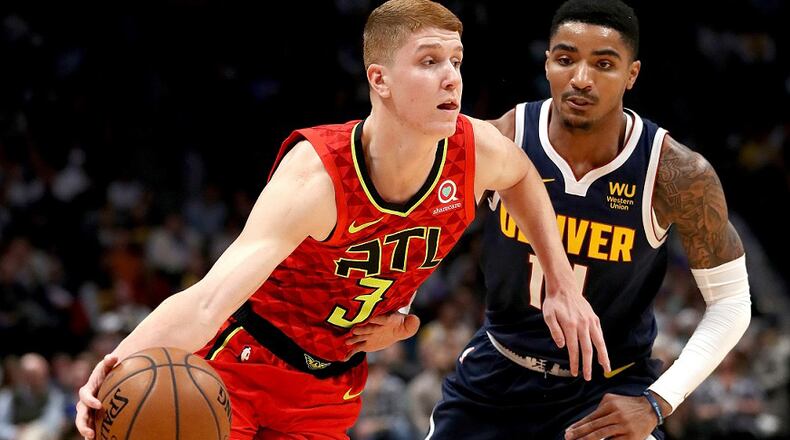 Kevin Huerter of the Atlanta Hawks drives against Gary Harris of the Denver Nuggets at the Pepsi Center on November 12, 2019 in Denver, Colorado. (Photo by Matthew Stockman/Getty Images)