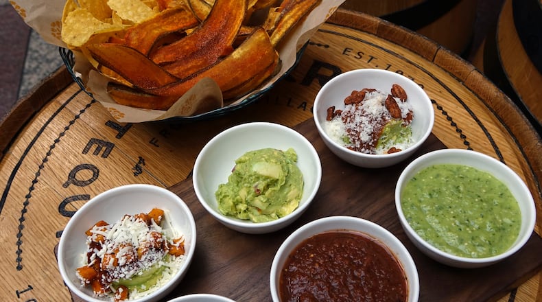 The guacamole and salsa tasting at Alma Cocina features three types each of guacamole and salsa with a basket of plantain chips and tortilla chips. / Photo by Fifth Group Restaurants