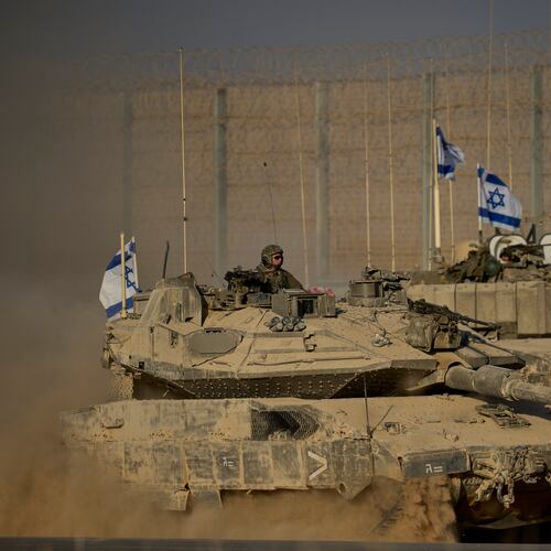 Israeli tanks move along the Israeli-Gaza border as seen from southern Israel, Monday, Oct. 20, 2025. (AP Photo/Ohad Zwigenberg)