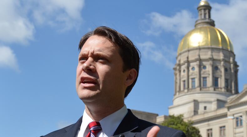 April 8, 2014. Sen. Jason Carter, who is running for governor of Georgia, speaks during a press conference Tuesday April 8, 2014. Carter called for an independent investigation into Gov. Nathan Deal's 2010 campaign. On Friday April 4, 2014 a Fulton County jury found the state ethics commission executive director, Stacey Kalberman, was unfairly forced from office as retribution for investigating Gov. Nathan Deal's 2010 campaign. BRANT SANDERLIN /BSANDERLIN@AJC.COM . State Sen. Jason Carter, the Democratic candidate for governor. Brant Sanderlin, bsanderlin@ajc.com