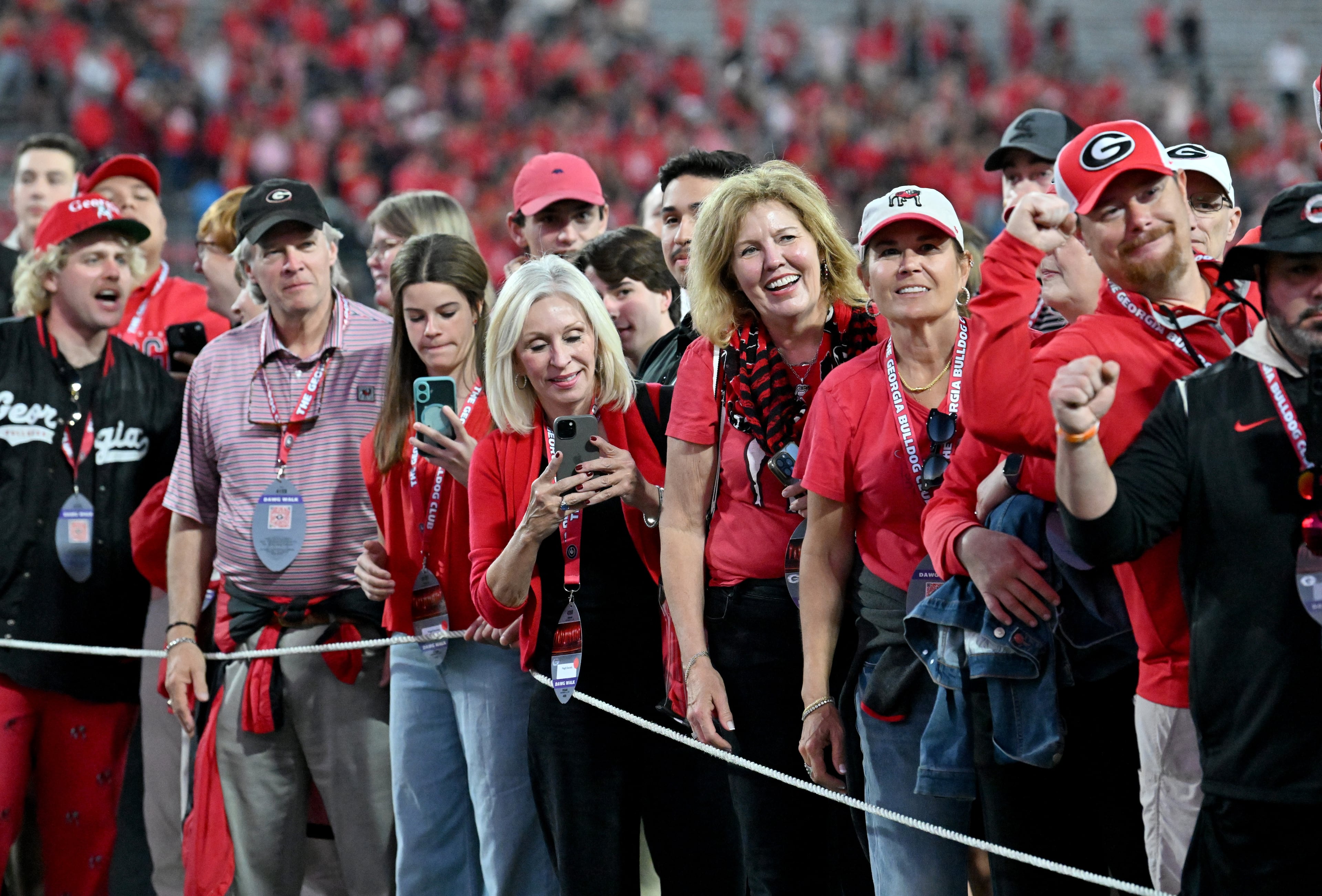 Georgia fans cheer as players and staff arrive during Dawgs Walk before an NCAA football game between Georgia and Texas at Sanford Stadium, Saturday, November 15, 2025, in Athens. (Hyosub Shin / AJC)