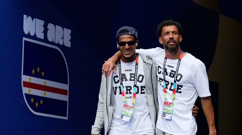 Cape Verde goalkeepers Vozinha, right, and Marcio Rosa walk onto the pitch for a team visit on the eve of their Group H World Cup match against Uruguay, in Miami Gardens, Fla., Saturday, June 20, 2026. (AP Photo/Rebecca Blackwell)