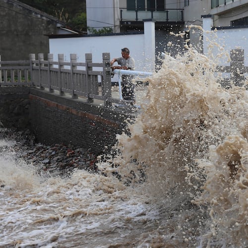 Huge waves crash on the coastline ahead of Typhoon Bavi in Wenling in eastern China's Zhejiang province, Friday, July 10, 2026. (Chinatopix Via AP) CHINA OUT