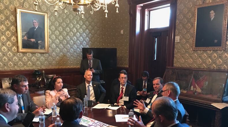 DeKalb County Commissioner Nancy Jester and Florida Gov. Rick Scott to her left talk with Interior Secretary  Ryan Zinke during an infrastructure meeting hosted by President Donald Trump in the White House on Thursday, June 8, 2017. Photo contributed by Nancy Jester