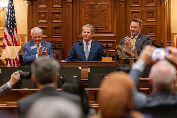 Gov. Brian Kemp, between Speaker Jon Burns and Lt. Gov. Burt Jones, gives his final State of the State speech in the House of Representatives at the Capitol in Atlanta on Thursday, Jan. 15, 2026. (Arvin Temkar/AJC)