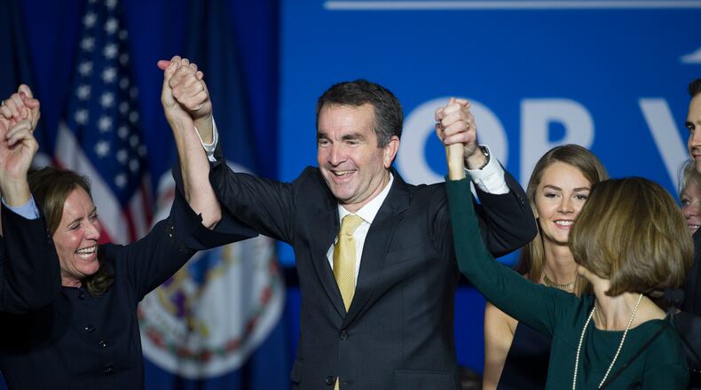 Virginia Gov.-elect Ralph Northam celebrates his election victory with his wife Pam and daughter Aubrey, right, and Dorothy McAuliffe, wife of Virginia Gov. Terry McAuliffe at the Northam For Governor election night party at George Mason University in Fairfax, Va., Tuesday, Nov. 7, 2017.