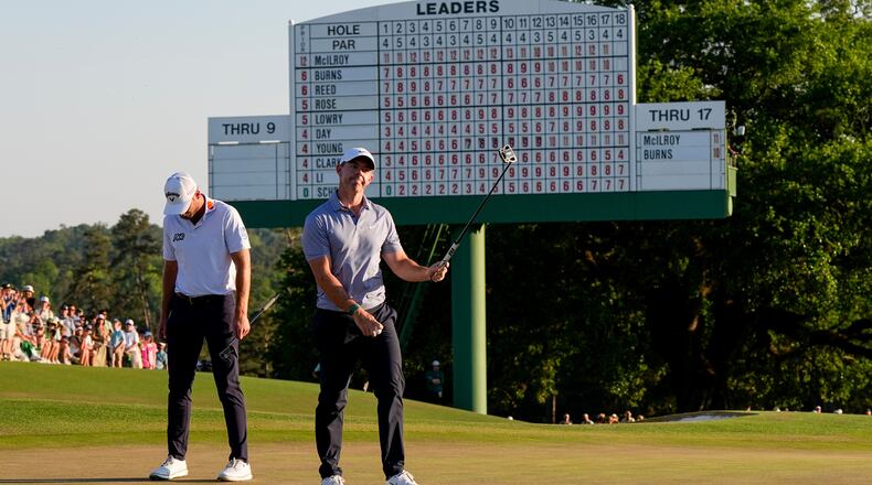 Rory McIlroy, of Northern Ireland, waves after his putt on the 18th hole during the third round of the Masters golf tournament at the Augusta National Golf Club, Saturday, April 11, 2026, in Augusta, Ga. (AP Photo/David J. Phillip)