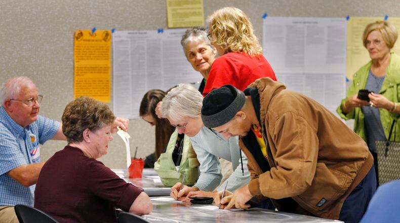 Voters cast ballots at the Tucker Library on Nov. 3 to overhaul the DeKalb Board of Ethics. BOB ANDRES / BANDRES@AJC.COM