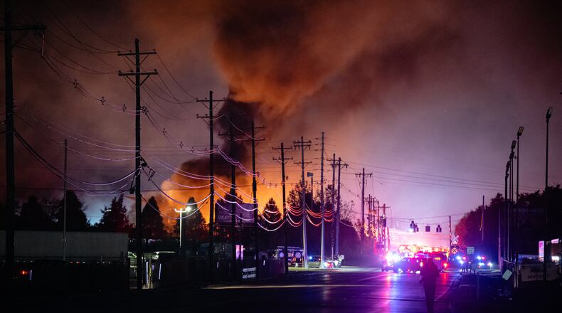 FILE - Plumes of smoke rise from the area of a UPS cargo plane crash at Louisville Muhammad Ali International Airport, on Tuesday, Nov. 4, 2025, in Louisville, Ky. (AP Photo/Jon Cherry, File)