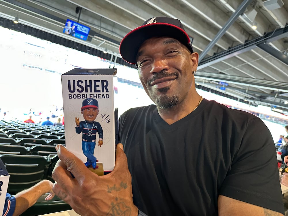 Terrell Franklin of Lawrenceville holds an Usher bobblehead, which honestly looks more like him than the R&B icon. 