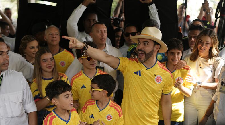 Presidential candidate Abelardo de la Espriella of the opposition Defenders of the Motherland movement arrives to vote with his family during the runoff election in Barranquilla, Colombia, Sunday, June 21, 2026. (AP Photo/Ivan Valencia)