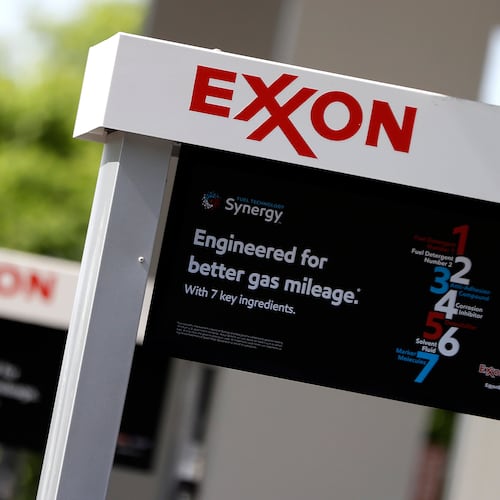 FILE- This April 25, 2017, file photo, shows Exxon service station signs in Nashville, Tenn.  (AP Photo/Mark Humphrey, File)