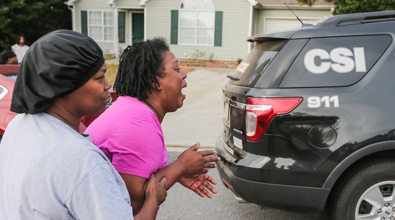 Teletha Walker grieves the death of her son, an 11th-grade student at Charles Drew High School in Clayton County. JOHN SPINK / JSPINK@AJC.COM