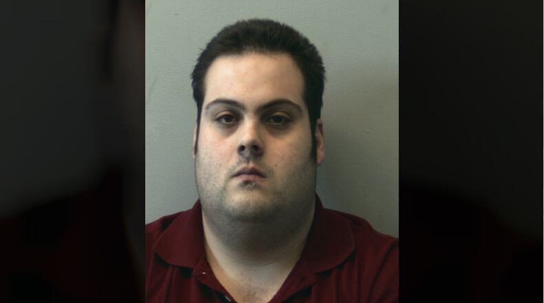 This booking photo released Thursday, March 1, 2018, by the Beverly Police Department shows Daniel Frisiello, of Beverly, Mass., accused of mailing five envelopes earlier this month with threatening messages and a white substance, including one to Donald Trump Jr., that landed his wife, Vanessa, in the hospital. Frisiello was held after an appearance Thursday in federal court in Worcester pending a detention hearing scheduled for Monday. (Beverly Police Department via AP)