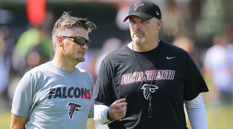 Falcons general manager Thomas Dimitroff (left) and coach Dan Quinn.  Curtis Compton / ccompton@ajc.com