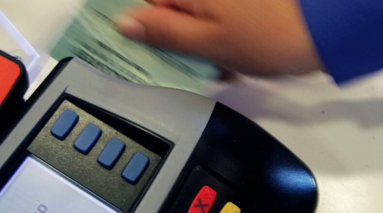 Worldpay, which was acquired a year ago, is cutting about one-third of its Atlanta workforce. The company has technology for processing payments. Here, the credit and debit card terminal on Ashford Dunwoody Dr. in Atlanta. (Bob Andres, bandres@ajc.com/)
