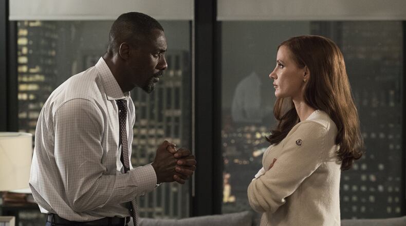 Idris Elba, left, and Jessica Chastain star in a scene from, “Molly’s Game.” Contributed by Michael Gibson/STXfilms