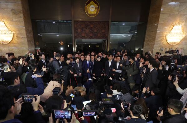 FILE - South Korea's main opposition Democratic Party leader Lee Jae-myung, top center, speaks at the National Assembly in Seoul, South Korea, on Dec. 4, 2024. (Kim Ju-hyung/Yonhap via AP, File)