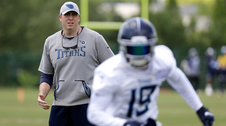 Tennessee Titans offensive coordinator Arthur Smith (left) watches as wide receiver Tajae Sharpe (19) runs a drill during an organized team activity  Tuesday, May 21, 2019, at the Titans' training facility in Nashville, Tenn. (Mark Humphrey/AP)