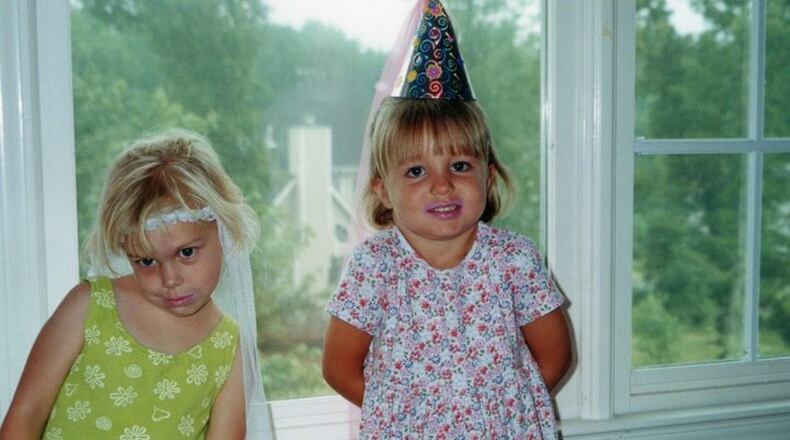 Brittany Feldman (left) and Kayla Canedo as toddlers. The two grew up together in north Fulton County. Feldman used this photo as her cover photo on Facebook. Her page was changed after their death to “Remembering Brittany Feldman.” Canedo’s page was also changed to “Remembering Kayla Canedo.” (Family photo)