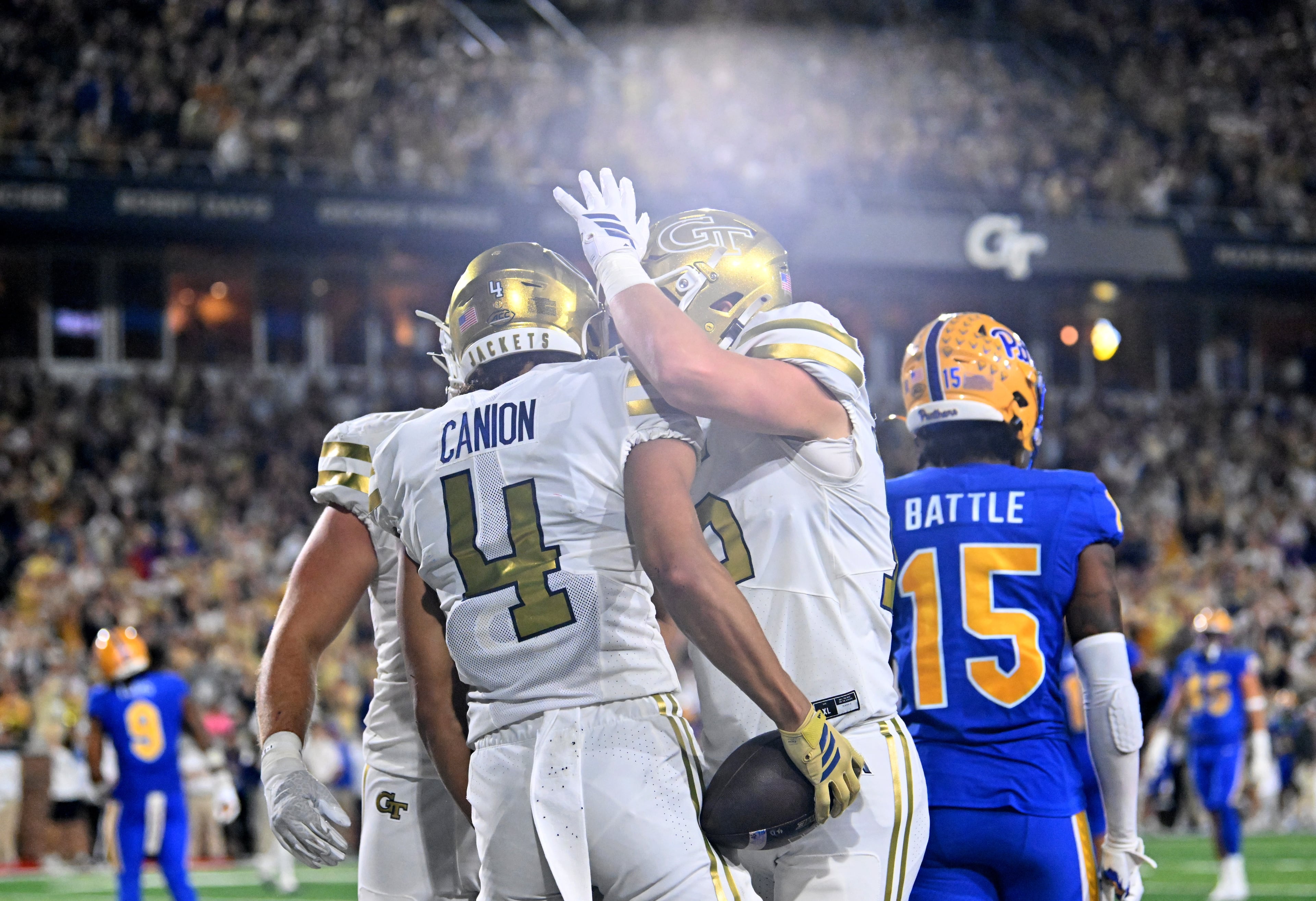 Georgia Tech wide receiver Isiah Canion (4) celebrates with teammates after scoring a touchdown during the second half in an NCAA college football game at Bobby Dodd Stadium, Saturday, November 22, 2025 in Atlanta. Pittsburgh won 42-28 over Georgia Tech. (Hyosub Shin / AJC)