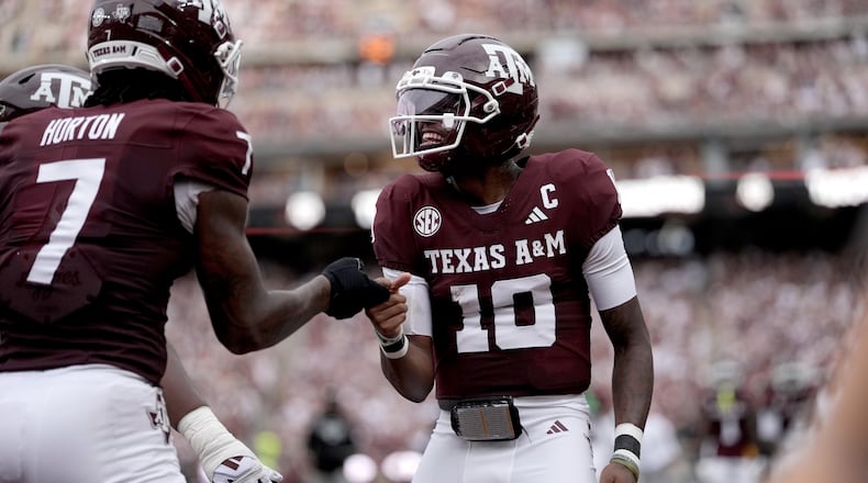 Texas A&M quarterback Marcel Reed (10) reacts with teammate Isaiah Horton (7) after a touchdown against Missouri State during the first quarter of an NCAA college football game Saturday, Sept. 5, 2026, in College Station, Texas. (AP Photo/Sam Craft)