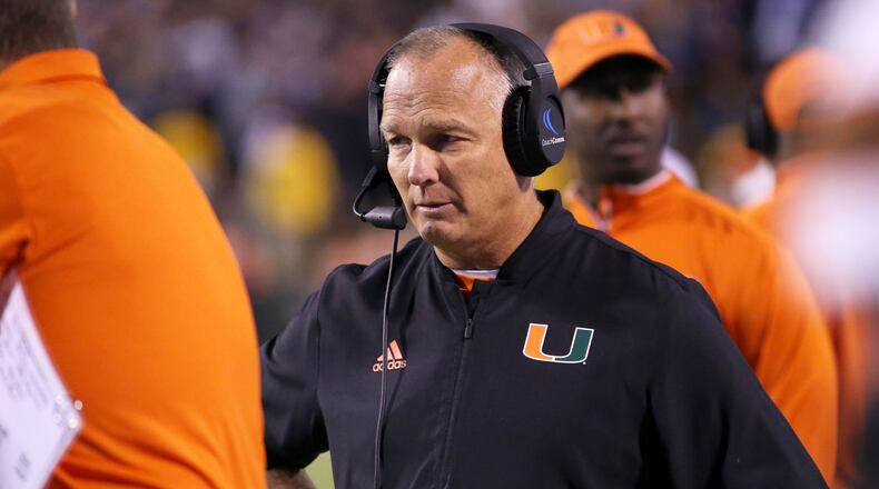 Miami Hurricanes coach Mark Richt waits out a review  early in what went on to become a three-point loss to Virginia. (Ryan M. Kelly/Getty Images)