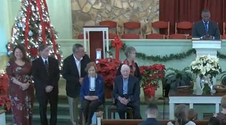 Former President Jimmy Carter and first lady Rosalynn Carter are seated at left in front of the congregation for a moment during the morning service at Maranatha Baptist Church in Plains on Sunday, December 29, 2019. (Photo from Maranatha Baptist livestream)