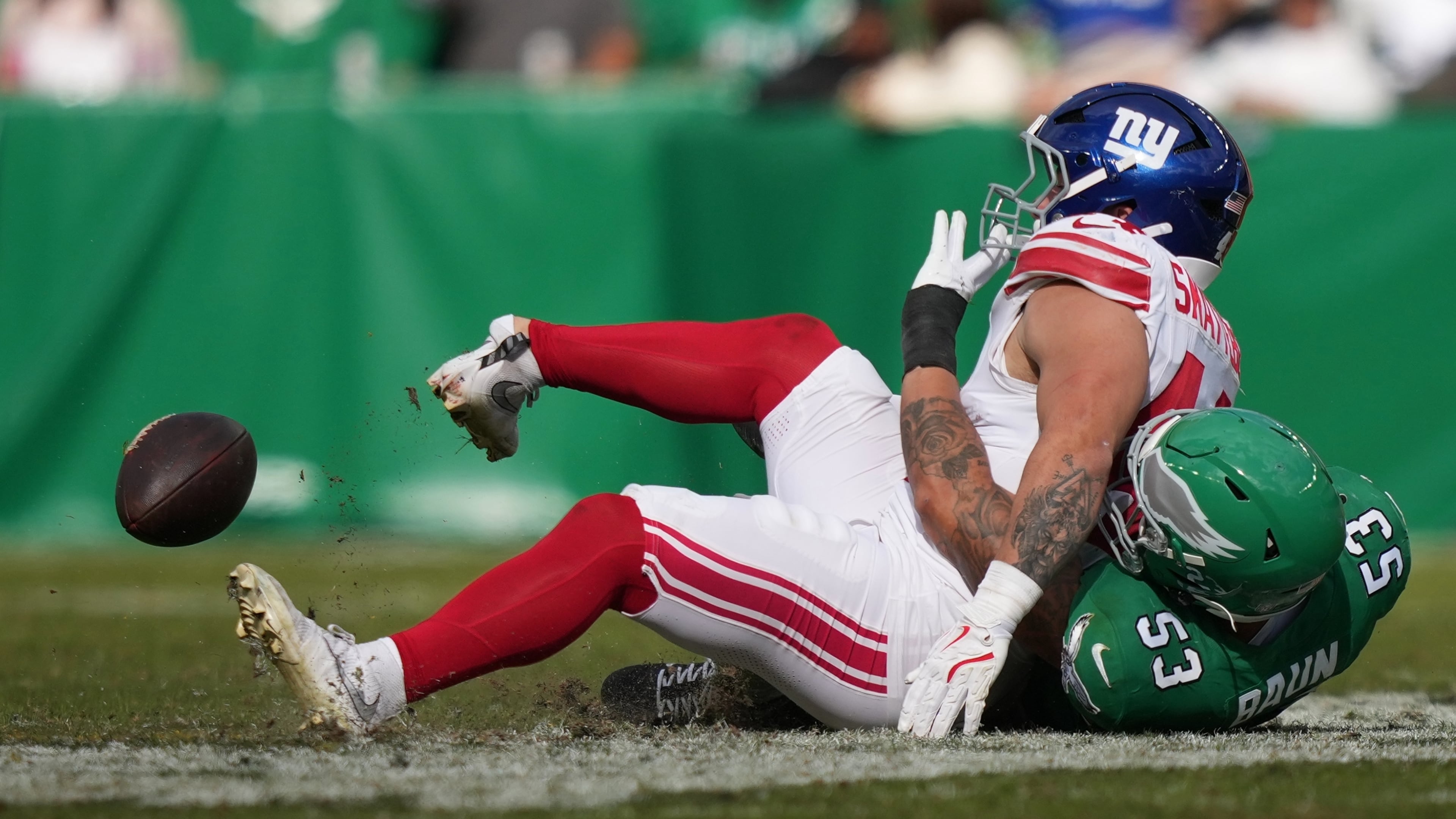 New York Giants running back Cam Skattebo (44) is injured near Philadelphia Eagles linebacker Zack Baun (53) during the first half of an NFL football game Sunday, Oct. 26, 2025, in Philadelphia. (AP Photo/Matt Slocum)