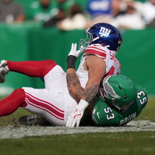 New York Giants running back Cam Skattebo (44) is injured near Philadelphia Eagles linebacker Zack Baun (53) during the first half of an NFL football game Sunday, Oct. 26, 2025, in Philadelphia. (AP Photo/Matt Slocum)