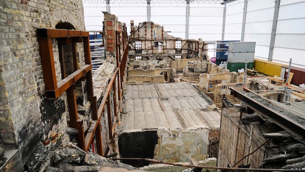 A general view on the remains of the fire-damaged Old Stock Exchange building in Copenhagen, Denmark, Monday, June 23, 2025. (AP Photo/James Brooks)