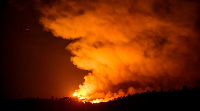 The Gann Fire burns along a hillside near Copperopolis on Tuesday, Aug. 4, 2026, in Calaveras County, Calif. (AP Photo/Noah Berger)