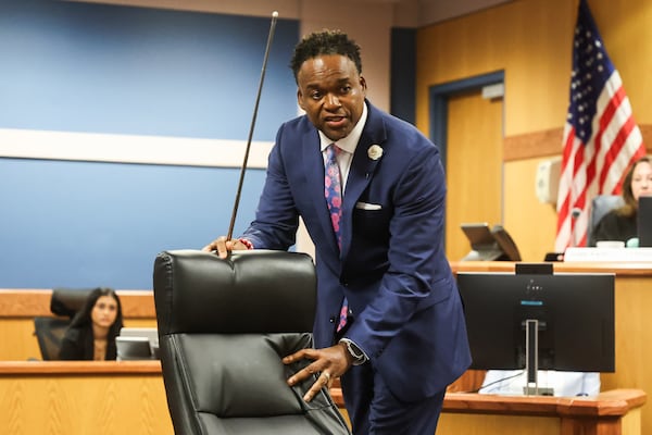 Defense Attorney Arnold Ragas demonstrates the bullet angle during opening statements in the trial of Julian Conley at Fulton County Superior Court in Atlanta on Wednesday, Sept. 17, 2025. (Abbey Cutrer/AJC)