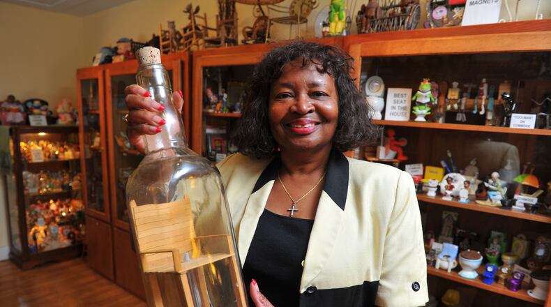 Barbara Hartsfield, owner of the Collectible and Antique Chair Gallery in Stone Mountain, boasts more than 3,000 miniature chairs. Among her favorites is this chair in a bottle. "Maybe one day I'll find out how they do that," she said.